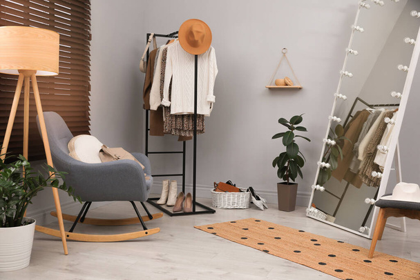 Modern dressing room interior with clothing rack and mirror - Photo, Image