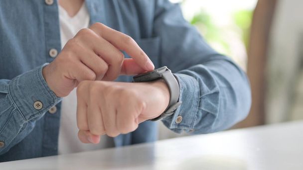 Hands of Man using Smartwatch - Фото, зображення