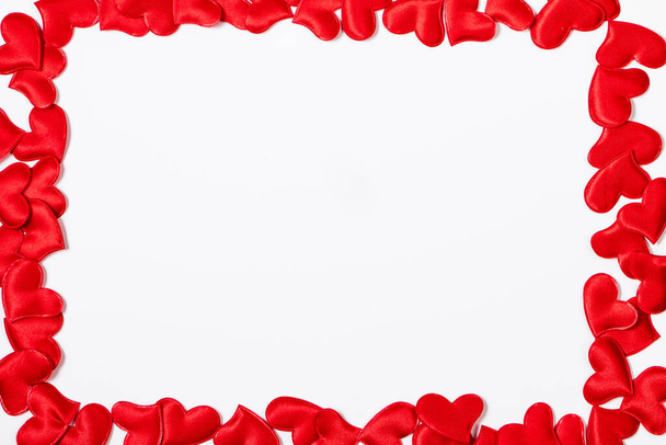 Valentine's day greeting card. Frame from red hearts on white background. Layout with place for text. - Photo, Image