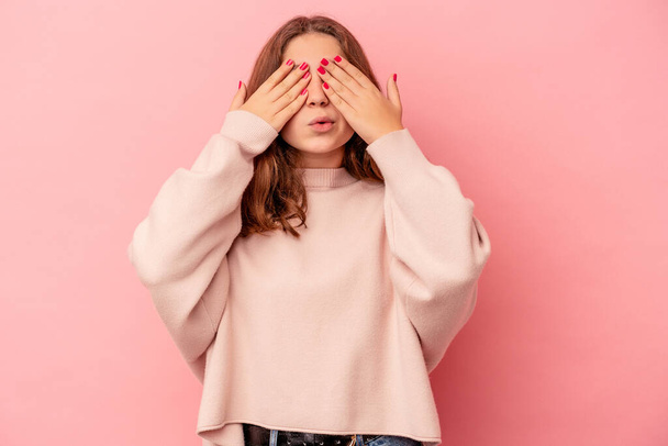 Little caucasian girl isolated on pink background afraid covering eyes with hands. - Φωτογραφία, εικόνα