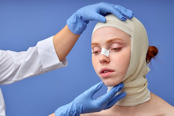 portrait of woman with bandage on head before plastic surgery operation, cropped doctors - Foto, Bild
