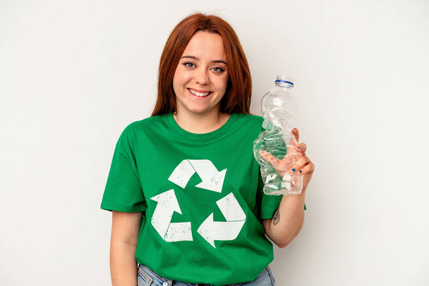 Young caucasian woman recycled plastic isolated on white background - Fotografie, Obrázek