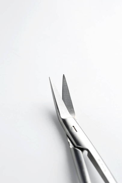 macro photo of surgical scissors on a white background - Фото, изображение