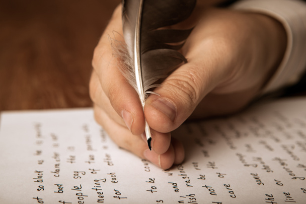 writer writes a fountain pen on paper work - Valokuva, kuva