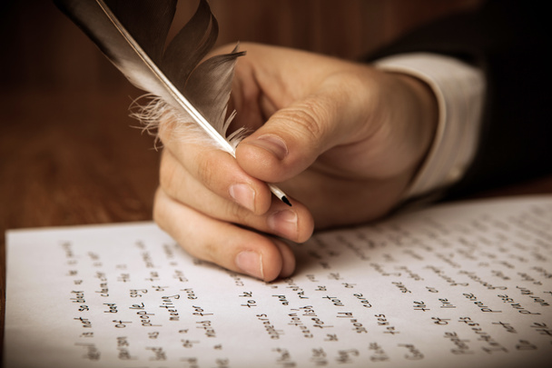writer writes a fountain pen on paper work - Photo, Image