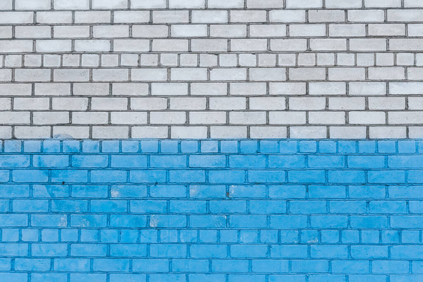 Old white brick wall painted blue paint urban design background texture. - Fotó, kép