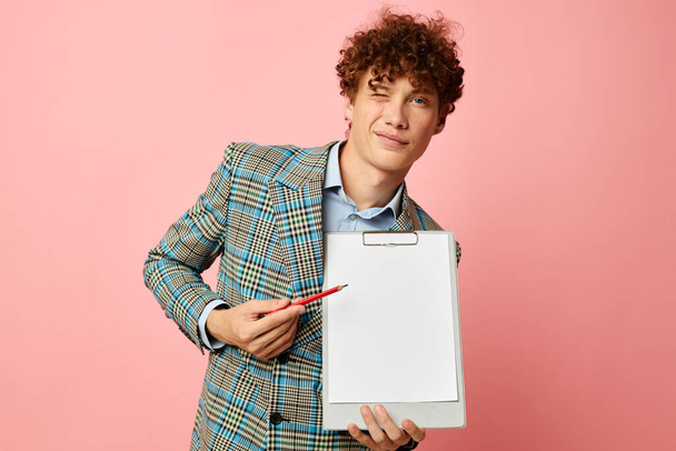 guy with red curly hair folder for papers blank sheet posing in suit isolated background unaltered - Photo, Image