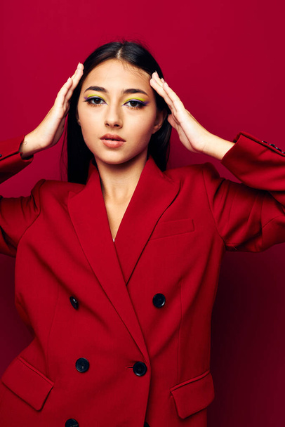 portrait pretty woman attractive look glamor cosmetics fashion red background unaltered - Valokuva, kuva