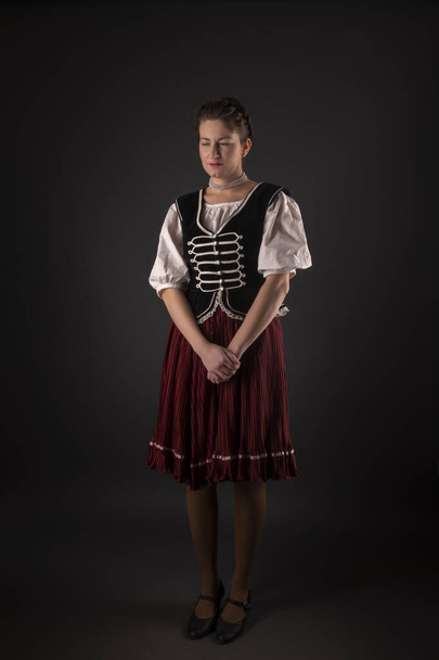 young beautiful slovak woman wearing traditional dress. slovak folklore - Foto, Imagen