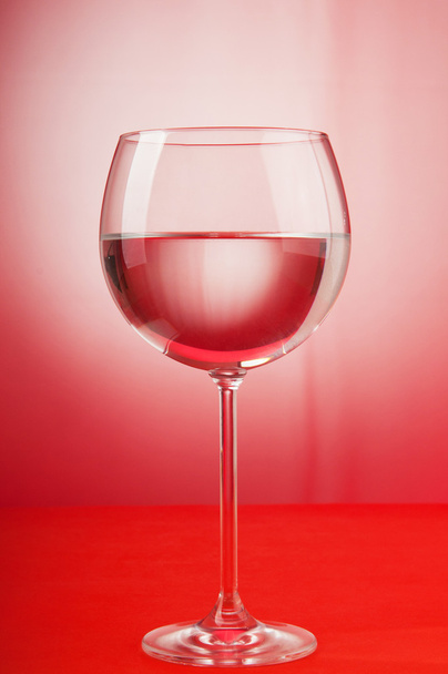 Water in the glass against gradient background - Foto, imagen