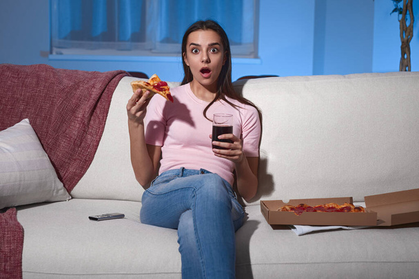 Shocked woman watching movie at home - Φωτογραφία, εικόνα