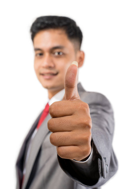 businessman showing thumb up close up to camera - Foto, afbeelding