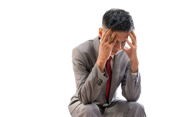 stressed businessman cover his face while sitting - Fotoğraf, Görsel