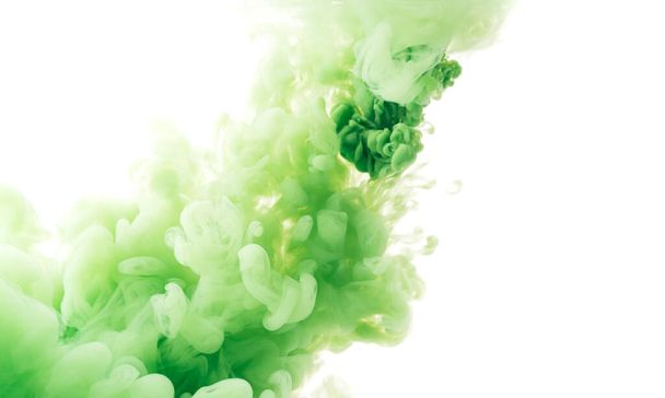 Diagonal splash of green paint in water against white background - Фото, зображення