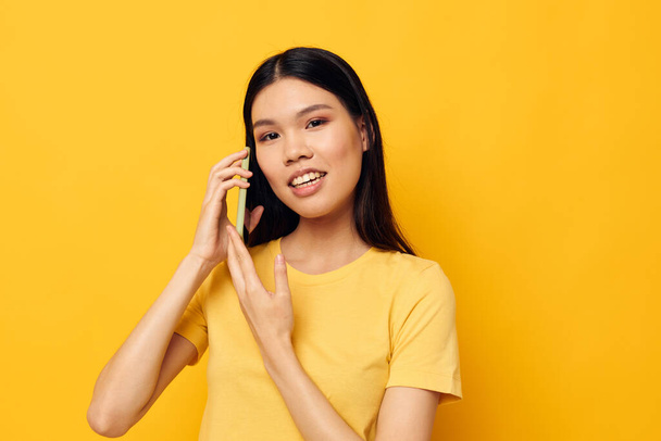 Portrait Asian beautiful young woman talking on the phone posing technology Monochrome shot - Zdjęcie, obraz