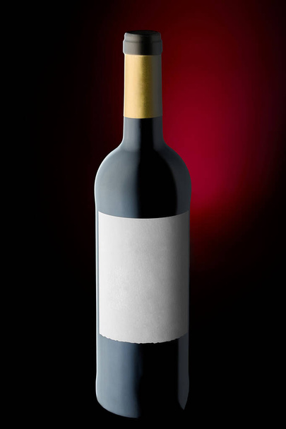 Wine bottle on black background with red backlight  - Фото, изображение