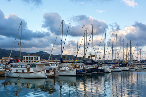 Port de Pollenca marina with sailing boats sailboats on Mallorca travel traveling holidays vacation boat in Spain - Foto, afbeelding