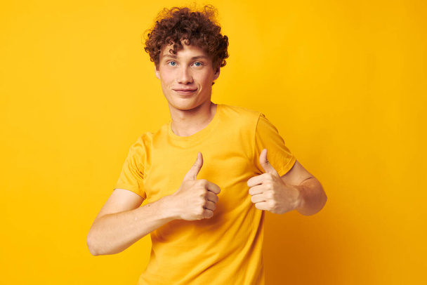 Young curly-haired man Youth style studio casual wear isolated background unaltered - Фото, зображення