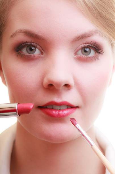 Woman applying lipstick with brush - Foto, Imagem