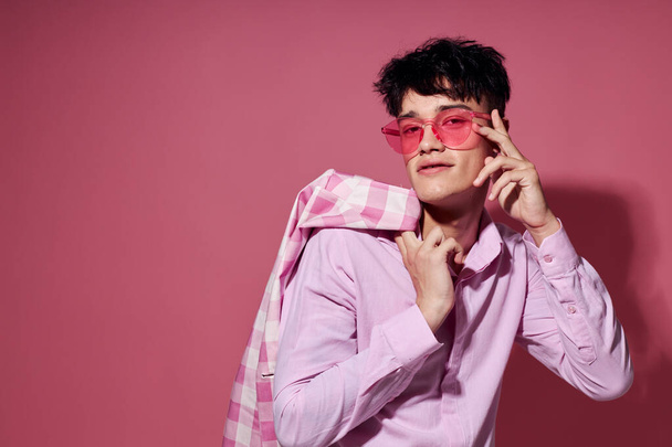 portrait of a young man pink shirt and glasses jacket fashion elegant style isolated background unaltered - 写真・画像