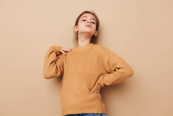 cute girl in sweater posing hand gestures isolated background - Foto, imagen