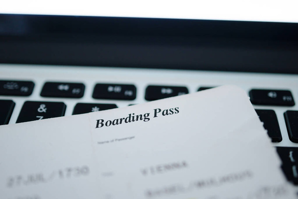 Focus on the Boarding pass with close-up macro text of during flight - laptop computer keyboard - - Fotó, kép