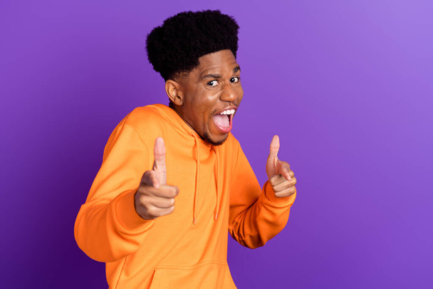 Photo of funky happy dark skin young man point fingers you choose cool excited isolated on purple color background - Foto, Imagen