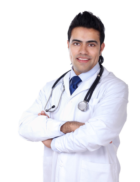 Male doctor sitting at the desk on white background - Foto, Imagen