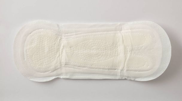 Soft protective and absorbent cotton wipe for women's care macro on white background. Top view. Horizontal composition. - Φωτογραφία, εικόνα