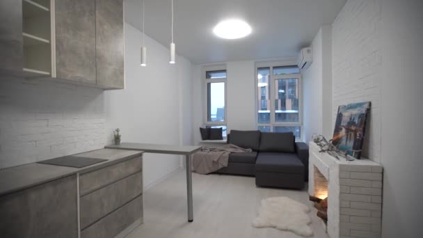 living room interior in modern minimalist design style with burning fireplace. - Video, Çekim
