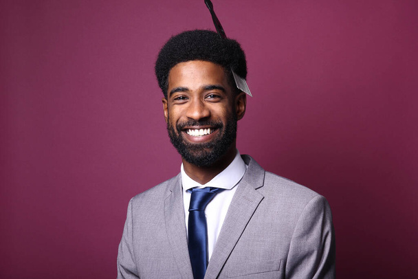 Portrait of a beautiful happy man in front of a colored background - Photo, image