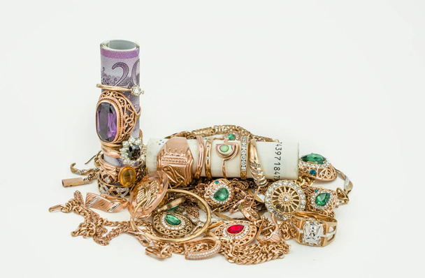 Pile of gold jewelry on white background - Fotoğraf, Görsel