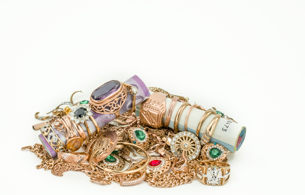 Pile of gold jewelry on white background - Foto, imagen