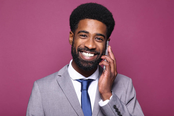 Portrait of a beautiful happy man in front of a colored background - Photo, Image