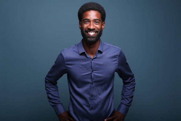 Portrait of a beautiful happy man in front of a colored background - Photo, Image