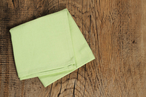 Kitchen linen napkin on wooden background with copy space. - Fotoğraf, Görsel