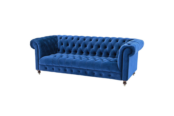 Navy blue quilted velvet classic sofa isolated on white background with clipping path. Series of furniture - Zdjęcie, obraz