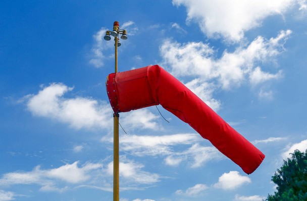 windsock inflated of air in heliport with blue sky on background. Sao Paulo city, Brazil - Foto, afbeelding