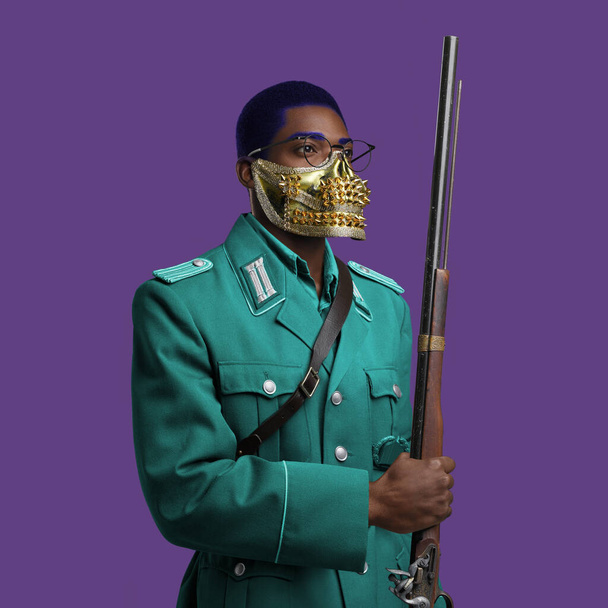 Military african man with weapon posing against colorful background - Foto, Imagem
