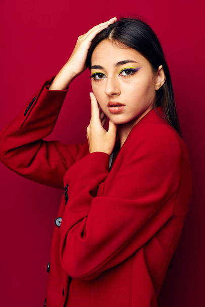 beautiful brunette fashion posing in red jacket isolated background unaltered - Fotografie, Obrázek