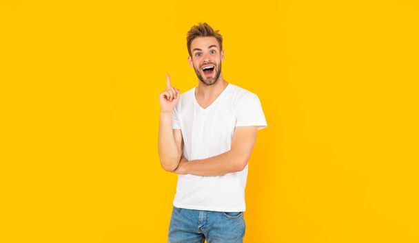 inspired with idea unshaven young man in white shirt on yellow background, inspiration - Photo, image