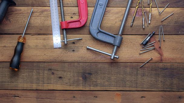 Collection of woodworking tools on a wooden background. - Fotoğraf, Görsel