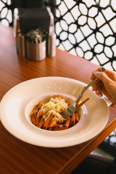 Tasty appetizing classic Italian pasta with a delicious sauce. - Fotoğraf, Görsel