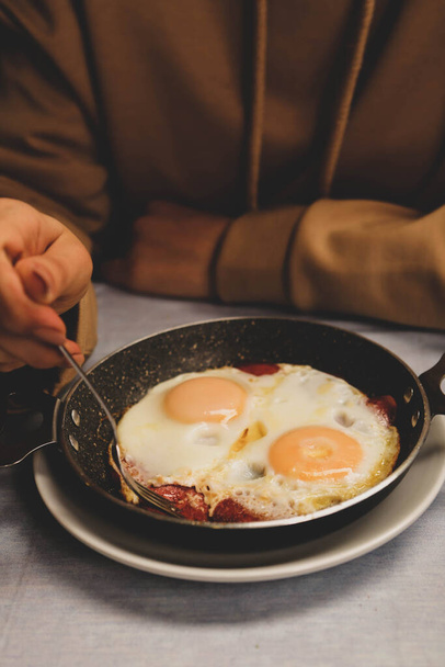 Delicious scrambled egg on the table  - Фото, зображення