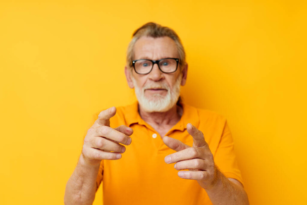 Photo of retired old man with a gray beard in glasses isolated background - 写真・画像