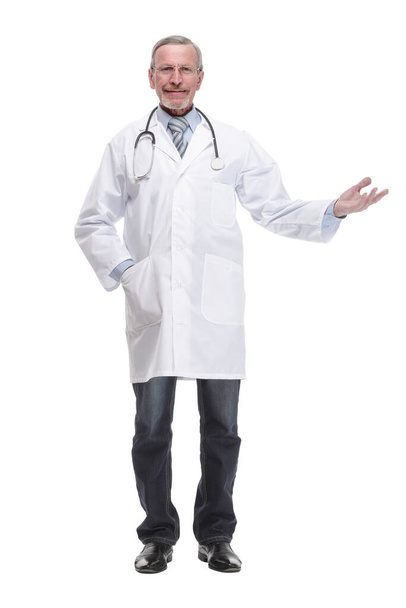 Cheerful mature doctor looking at camera and pointing away - Photo, Image