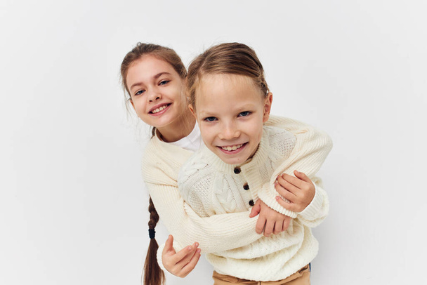 two little girls standing side by side fun childhood - Foto, immagini
