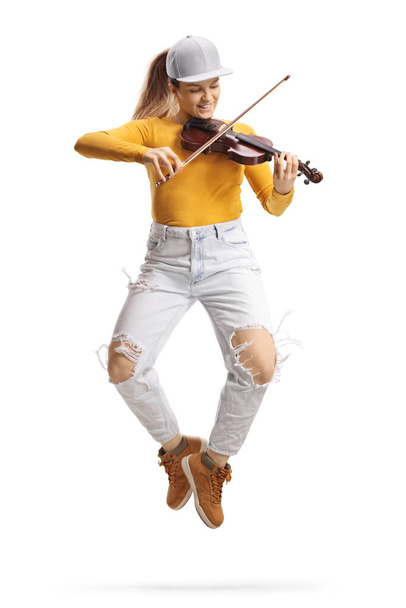 Trendy young female violinist playing a violin and dancing isolated on white background  - Zdjęcie, obraz