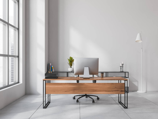 Light workplace room interior with wooden table and computer pc, grey tiled floor. Panoramic window with skyscrapers. Copy space empty white wall, 3D rendering - Foto, imagen