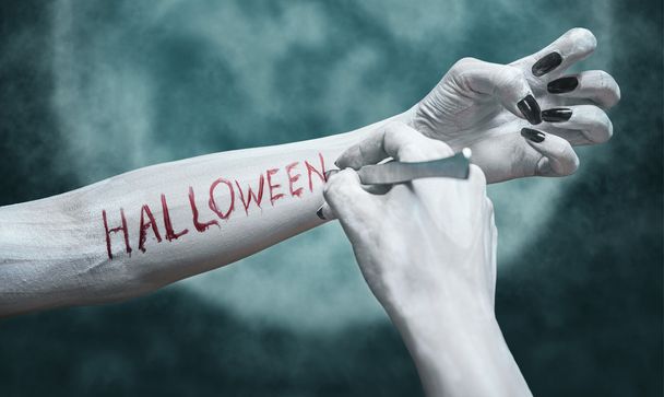 Writing Halloween on arm - Valokuva, kuva